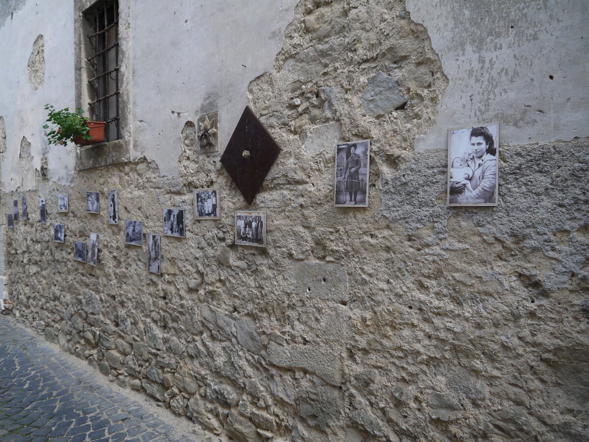 Historical photo exhibition on the wall of Palazzo Vecchiarelli