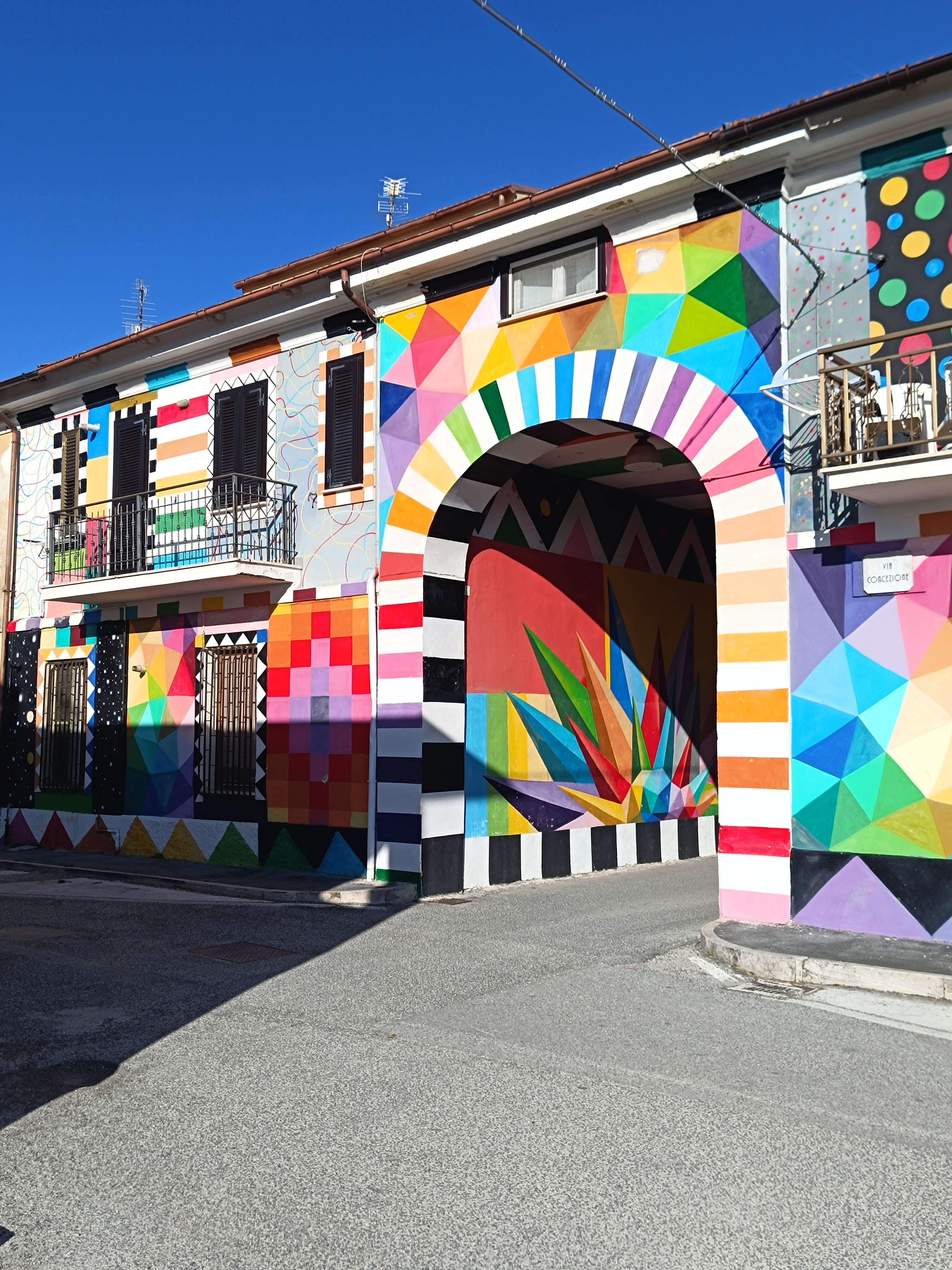 The famous mural of Aielli — bold colours on ancient stone