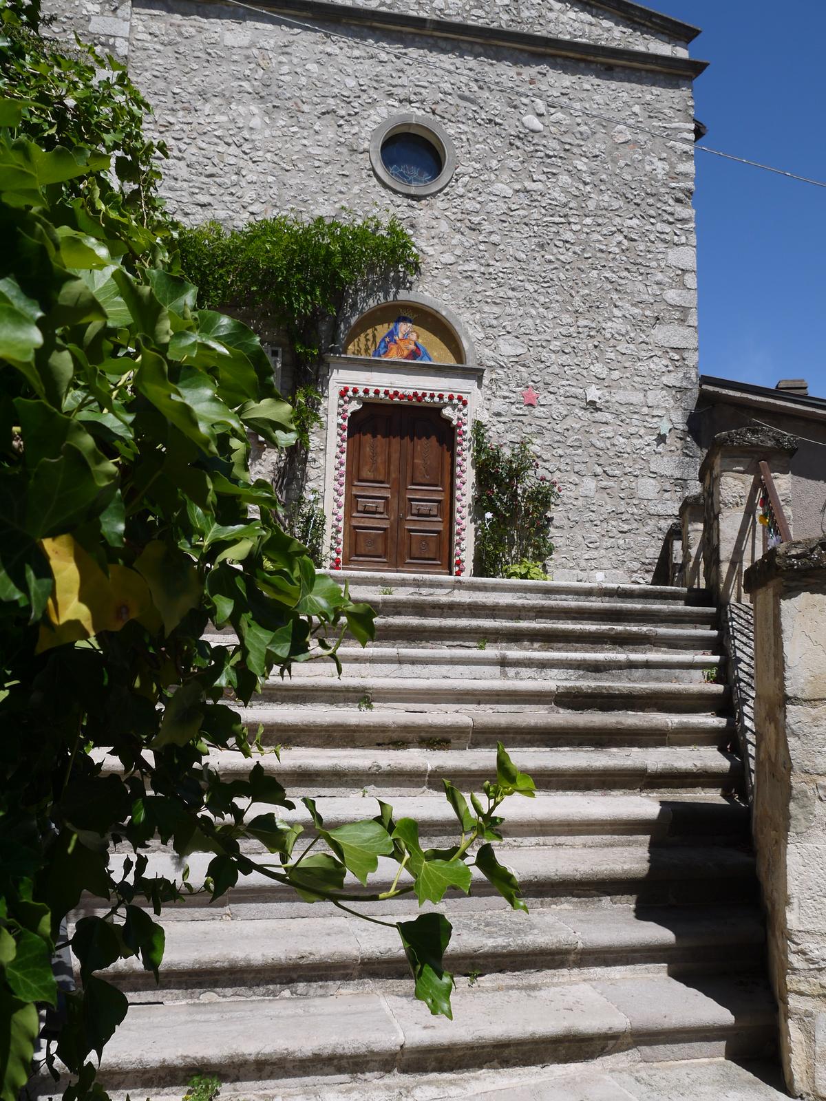 The stone facade and stairway of the church of Santa Maria delle Grazie