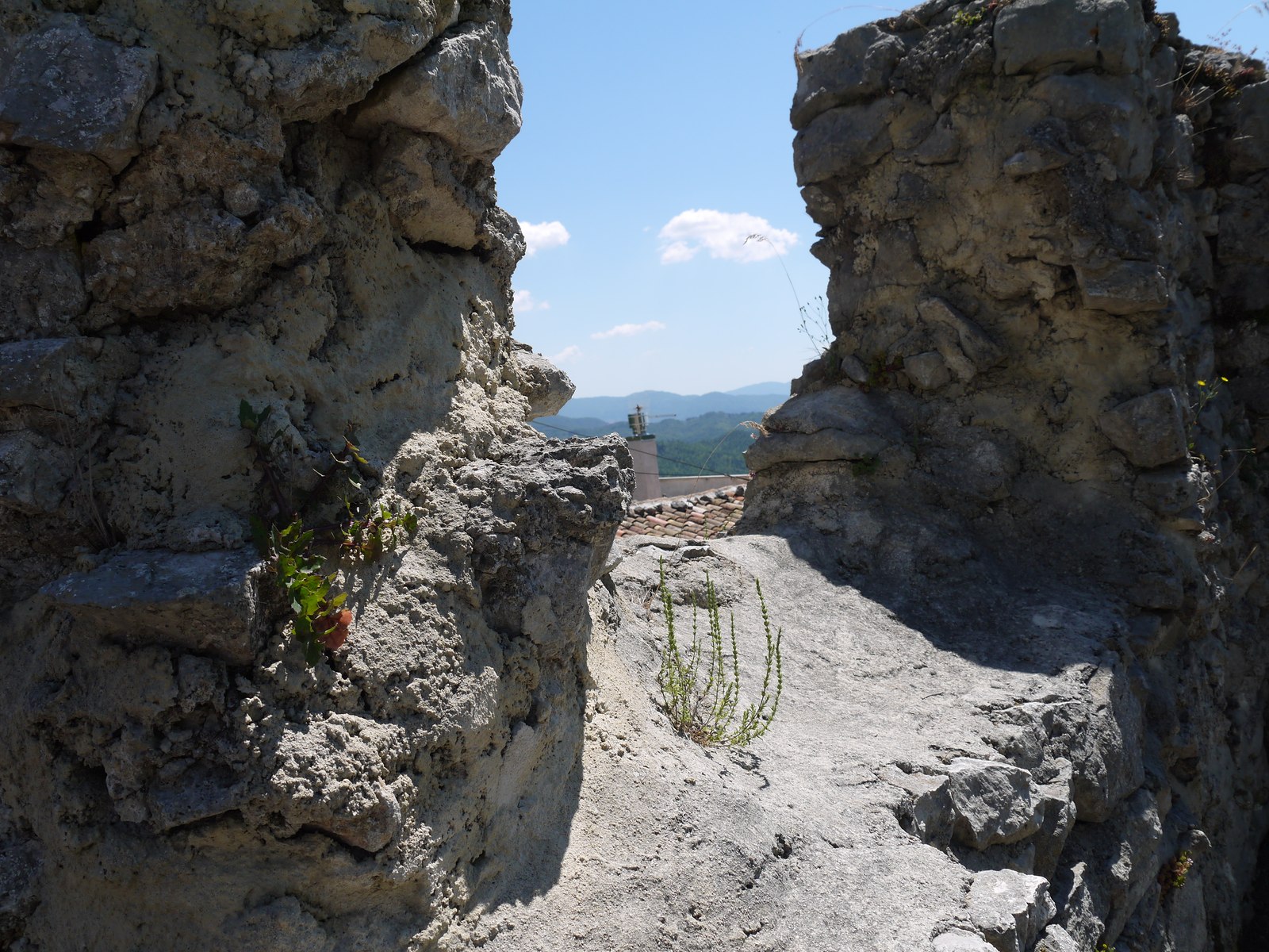 The roofless stone walls of the ruined church of Santo Stefano