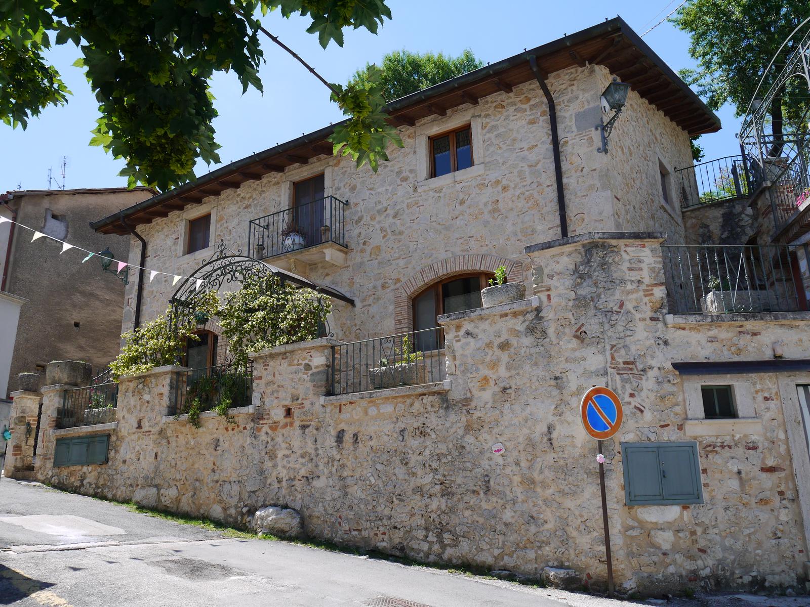 The main street of Pietrasecca, lined with stone houses